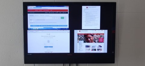 Picture of flat screen TV with multiple device displays on it at once